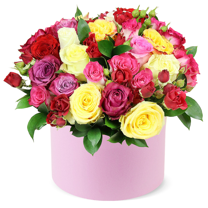 An opulent, multi-colored rose bouquet sits in a soft pastel pink round hat box, a striking gift that speaks of abundance and celebration. Dozens of roses in sunlit yellow, classic red, fuchsia, pale pink, magenta, lavender, and ivory mingle in a dense, domed cluster. Each bloom shows velvety, layered petals-some fully opened, others still tender buds-creating a lush tapestry of texture. Dark green leaves weave through the blossoms, peeking over the rim of the box and lending a natural, garden-picked feel. The box's smooth matte pink finish anchors the display with modern sophistication. The white background makes the colours seem even more vibrant, like a window into a bright, joyful composition. Perfect for luxury gift-giving or special occasions, this piece conveys celebration, romance, and heartfelt appreciation. It suits birthdays, anniversaries, or Mother's Day, and it travels well across Brent Cross and neighbouring areas with reliable same-day delivery. A refined choice for a weekend surprise or a bouquet delivered to brighten a patient's day, it reflects the skill of a Brent Cross florist who understands how colour and form can lift a room.