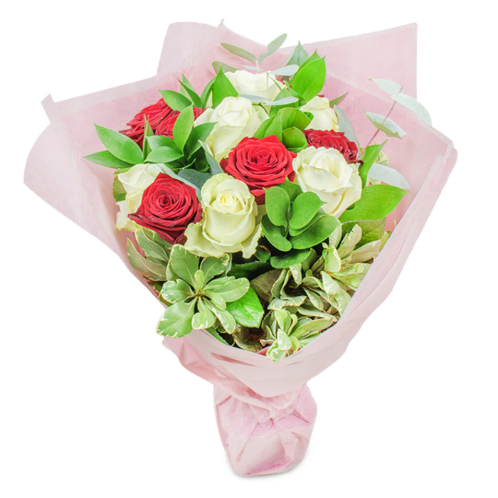 Expertly designed by Brent Cross Flowers, this hand-tied bouquet is a study in balanced contrast and textural complexity-perfect for the heart of North West London. Approximately twenty roses form the centrepiece, their petals unfurled in a striking interplay of ten deep red and ten creamy white blooms. The quality and freshness are unmistakable; each flower is set at the peak of its beauty, showcased against a pristine white backdrop. A lush canopy of greenery surrounds the roses, including dark green ruscus, rounded lighter leaves reminiscent of Brent Cross's well-kept gardens, silvery eucalyptus for an airy touch, and cream-edged variegated foliage providing visual interest and organic abundance. The bouquet's dome shape exudes fullness and elegance, while gossamer layers of pastel pink floral paper gather at the base, their translucence catching the light like an early morning mist in Golders Hill Park. Tied with care, this presentation suits special events-romantic anniversaries, tokens of admiration, or thoughtful congratulations for residents in and around Brent Cross. The gentle scent of roses mingled with garden greens offers a comforting, familiar note. Each detail, from flower to wrap, bears the hallmark of local expertise and community connection, making this bouquet an exquisite ambassador of Brent Cross's botanical artistry.