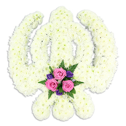The photograph presents a stately Sikh Khanda floral tribute, carefully styled for a funeral or memorial, set in stark relief against a smooth white background. The entire Khanda emblem is cloaked in neat, closely packed white chrysanthemums, forming a continuous surface that captures every contour of the central sword, the encircling chakkar, and the two elegant kirpans sweeping down and outwards. The petals create a velvety, almost tactile texture, with light brushing across them to reveal gentle variations in cream and pearl tones, adding life to the solid white mass. The shape is instantly recognisable, both powerful and serene. Nestled at the base, where the crossed blades would rest, a smaller, jewel-toned posy introduces contrast. Three rounded pink roses, slightly cupped and fresh, sit at its heart, surrounded by rich purple flowers and a collar of green fern fronds that add feathery detail. This touch of colour appears like a carefully considered offering at the feet of the symbol, layering the tribute with emotions of love, remembrance, and quiet gratitude. Visually, the design feels balanced and calm, suitable for a Sikh family in Brent Cross wishing to honour their loved one's faith and heritage. One can picture this arrangement resting near the front during a service, then perhaps accompanying the family from Brent Cross or nearby Cricklewood to their chosen resting place. Crafted with sensitivity and local understanding, the tribute embodies both spiritual significance and the gentle comfort that fresh, seasonal flowers bring at a time of loss.