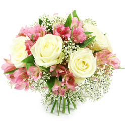 A beautifully composed bouquet of creamy white roses, pink alstroemeria, and airy baby's breath is presented against a smooth white background, creating a sense of calm that allows the colours and textures to shine. Several fully opened roses form the core of the design, each blossom with petals layered in soft curves that gradually loosen toward the outer edge, giving the flowers a cushiony, rounded look. Their centres glow with just a hint of pale yellow, adding warmth and suggesting a gentle, comforting light. Clustered between the roses, the alstroemeria blooms introduce a lively, joyful contrast, their trumpet-shaped petals shaded from pale blush through to intense fuchsia, with slender streaks and speckles in deeper tones that draw attention toward the throat of each flower. Fine stems of Gypsophila thread their way throughout the bouquet, carrying dozens of tiny white blooms that mimic a scattering of stars or a dusting of frost, softening the overall shape and adding a dreamy, romantic air. Fresh green leaves cradle the blossoms, with smooth, elongated shapes that curl slightly and give structure to the arrangement without overwhelming it. At the base, the green stems are tied neatly together in the classic style of a hand-tied bouquet, their cut ends clean and aligned, suggesting it has just been fashioned by an experienced florist in Brent Cross, ready to be delivered across the local streets toward Golders Green, Cricklewood, or along the North Circular. The lighting is bright but gentle, revealing the velvety surfaces of the petals and the crispness of the foliage. This bouquet feels serene yet celebratory, perfect for offering congratulations, sending affection, or bringing a soft touch of elegance into a Brent Cross living room after a busy day at the nearby shopping centre.