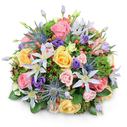 This image presents a beautifully domed bouquet of fresh flowers set against a crisp white background, a style often prepared for same-day delivery across Brent Cross and the surrounding North West London neighbourhoods. The bouquet is lush and densely packed, forming a smooth, rounded outline where colours blend yet remain distinct. Garden roses in soft pastel shades of pink, yellow, and peach dominate the composition, their layered petals creating a plush, almost cushion-like texture. Some blooms are fully open, revealing intricate spirals at their centers, while others are just beginning to loosen from tight buds, adding a sense of life and unfolding time. Threaded through this romantic bed of roses are airy clematis flowers in white and pale lavender, their star-shaped petals and bright yellow centers dancing lightly across the surface. Blue eryngium, or sea holly, punctuates the design with its spiky, steel-blue heads, offering a cool, modern note that contrasts with the softness surrounding it. Among the blooms nestle deep purple lisianthus, from rounded buds to partially open cups, creating pockets of shadow and visual depth. Bright red hypericum berries dot the bouquet in small clusters, their glossy surfaces catching the light like tiny jewels. A generous collar of foliage in varied greens-broad, shiny leaves, fine feathery sprigs, and subtle hints of burgundy-cradles the flowers and softens the dome. The lighting is even and gentle, casting a faint shadow beneath that underlines the bouquet's volume without distraction. Overall, the arrangement feels like a joyful, well-balanced design, ideal for brightening a living room near Brent Cross station, marking a milestone, or simply sending a warm, uplifting message across NW2 and NW11.