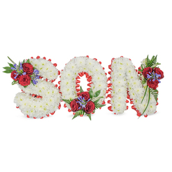 Arranged with careful hands and quiet intention, this floral composition spells the single word SON in large sculpted letters, each letter densely covered in small, pristine white spray chrysanthemums that form a soft, cloud-like surface. The white blooms are edged in a scalloped ribbon of bright red satin - each pleat catching light and giving a neat, refined outline that separates the letters from the white background. At three points on the lettering are elegant accent groupings: the S bears a cluster of deep red roses and blue-purple spikes at its upper curve, the O is warmed by a similar cluster tucked into its lower centre, and the N carries a cascading grouping of roses and slender violet-blue blooms down its right side. Rich green foliage, including delicate fern fronds and trailing leaves, knits the composition together and adds depth, while the small blue-purple spikes (likely Liatris or delphinium) lift the gaze and introduce a cool, contemplative note. In soft daylight the chrysanthemums' texture reads as comforting and pure, and the roses' velvety crimson speaks of enduring love and loss. This piece is intended as a personalised funeral tribute for a son, suitable for display at a service, wake, or graveside. As a Brent Cross florist mindful of local families in Cricklewood and the surrounding neighbourhoods, I picture this arrangement offered with thoughtful care and discreet delivery to services across the area.