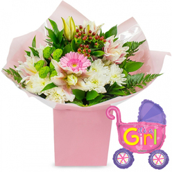 This image shows a tender new baby girl celebration arrangement, styled with care and set against a plain white background for maximum clarity. The main focus is a lush bouquet that rises from a sleek, square light-pink gift box, reminiscent of the pretty boxed displays often ordered for homes around Brent Cross and along the Edgware Road. The stems are wrapped in soft, ballet-pink tissue paper and encased in clear cellophane, which glints gently and suggests freshness as if the bouquet has just been finished by a local florist. From this neat base, the flowers expand into a rounded, overflowing dome. At the heart of the design is a bright pink gerbera daisy, its open face and layered petals giving a sense of instant joy. Surrounding it are white chrysanthemums, each bloom densely filled with slender petals that create a lush, pillowy texture. Woven throughout are alstroemeria lilies in delicate shades of soft pink and white, their petals spattered with fine speckles and streaks, adding an intricate, almost hand-drawn detail. A single yellow lily bud reaches upward, not yet open, hinting at more colour to unfurl as days go by. Lime-green button-style blossoms dot the arrangement, providing a crisp, contemporary contrast to the softer tones, while small clusters of deep red hypericum berries lend richness and depth. The composition is framed by dark-green leaves and light, feathery fern fronds, which soften the edges and give the bouquet a natural, garden-fresh feel. To the right, a shiny foil balloon shaped like a baby pram hovers, its body a bright, metallic pink with a purple hood and purple wheels, each wheel detailed with colourful spokes. Bold yellow and green lettering on the side declares, "It's a Girl!", accented by tiny hearts. Together, the flowers and balloon create a vivid, uplifting tribute, perfect for welcoming a newborn girl into a family home near Brent Cross station or one of the neighbouring residential streets.