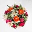 Effervescent and overflowing with colour, this bouquet captures the happy spirit of Brent Cross with every carefully selected bloom. At the centre, radiant orange gerberas send out sparks of joy, their vibrant petals animated by shafts of natural daylight, while velvety magenta carnations and soft blush roses add sumptuous layers of texture and depth. Snowy white alstroemeria blossoms and clusters of miniature daisies are scattered thoughtfully throughout, providing moments of airy lightness-like the first rays of morning sun glinting off the waters of Brent Reservoir. The foliage is both ample and measured, framing the flowers with deep green, polished leaves that call to mind peaceful walks through local parks. The colour palette is rich yet beautifully blended, giving the bouquet a harmonious warmth. Whether it's given for a birthday, joyful celebration, or simply to welcome spring into a Brent Cross home, this expertly crafted arrangement delights the senses and adds a note of optimism to any occasion across the NW2 and NW4 area.