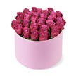 From Brent Cross Flowers in the Brent Cross neighbourhood, this luxurious rose arrangement presents itself as a densely packed dome of deep fuchsia blooms, housed in a light pastel pink round hat box with a soft, velvety matte finish. Dozens of fresh roses nestle tightly, their petals showing a subtle gradation from lighter pink centers to richer berry-toned edges, a colour lift that catches the eye from every angle. The bouquet fills the opening of the box and even rises slightly over the rim, creating a sense of lush abundance that feels like a generous gesture of love and celebration. A hint of dark green foliage peeks through here and there, but the roses remain the star, their fragrance and form still evident in the air. The photograph is taken from a gently elevated perspective against a bright white background, which makes the colours sing and accentuates the box's clean, sophisticated silhouette. In a Brent Cross home or office-whether near the bustling Shopping Centre, along Mill Lane, or close to Hendon Park-this flawless gift communicates romance, luxury, and festive intent. It's ideal for marking anniversaries, milestone birthdays, or a grand gesture; a high-end floral gift that travels with the assurance of same-day delivery across Brent Cross and surrounding NW London streets.