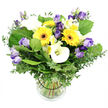 From Brent Cross Flowers in the Brent Cross area, a lush, sunlit bouquet sits in a clear glass vase against a bright white backdrop, its cheerful mood almost tangible. The arrangement centers on bold, sunny yellow Gerbera daisies, their wide faces opening wide as if greeting the day, each bloom with a distinct dark center that anchors the composition. Interwoven among them are clusters of Lisianthus in lavender to deeper purple hues, some fully open, others poised as delicate buds, adding soft, velvet texture and depth. Nestled among these are pristine white Calla lilies, their smooth, trumpet-shaped spathes lending a modern note to the garden-like scene. Sprigs of white Alstroemeria provide subtle variegation, with faint ribbons of yellow or green that catch the light. The bouquet is crowned with generous greenery: silvery-green eucalyptus branches that release a faint, fresh fragrance and broad emerald leaves that give volume and frame the blossoms with quiet elegance. The glass vase is transparent, revealing neatly arranged green stems immersed in clean water, while a discreet black tie around the stems helps maintain structure. This radiant arrangement embodies freshness, warmth, and heartfelt sentiment, perfectly suited for celebrating milestones or brightening a Brent Cross home. It speaks of sunny days on Cricklewood Green or Hendon streets, and of the thoughtfulness that Brent Cross Flowers brings to every delivery, often available for same-day service across the surrounding NW communities. A bouquet that feels like a little sun captured in glass, ready to convey warm wishes, joy, and a touch of everyday luxury.