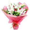 A graceful bouquet of white Oriental lilies and soft pink roses is shown in full view, carefully arranged so that each element is visible against a pure white background. The lilies stand tall and proud, their large, trumpet-shaped blooms unfolding in layers of smooth, white petals that gently curve outward. In their centres, slender stamens tipped with rusty orange-brown anthers emerge, bringing depth and a hint of natural drama. A few lily buds remain sealed or only just beginning to part at the tips, with subtle green veining and creamy hues that suggest freshness and the promise of more blossoms to come. Between these stately flowers, clusters of pink roses nestle closer to the heart of the bouquet. The roses appear mostly in bud or early bloom, their petals tightly wrapped in spirals, with a soft blush hue that deepens towards the centre, creating a gentle, romantic play of colour. Encircling the flowers is a flourish of dark green foliage, including broader, glossy leaves and finer, grass-like stems that add texture and a sense of movement, reminiscent of the planted borders near Brent Cross and along local streets towards Hendon and Golders Green. The entire bouquet is cocooned in a generous layer of bright, glossy pink cellophane or floral paper, which is gathered into flowing ruffles that catch the light, giving a celebratory, almost gift-wrapped feel. Around the base, a slim lime green ribbon is tied neatly, its fresh, citrus-like tone echoing the greenery and adding a modern touch. This bouquet feels perfectly suited to same-day delivery in Brent Cross for occasions like birthdays, thank-you gestures, or simply brightening a loved one's living room with a blend of fragrance, softness, and refined style.
