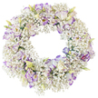 This image features a meticulously arranged funeral wreath, its perfect circular form accentuated by a backdrop of pure white that allows every floral detail to be clearly seen. The wreath's structure is almost entirely enveloped by dense white baby's breath, thousands of tiny Gypsophila blossoms creating an effect of airy foam or soft snowfall. This delicate texture encircles the open middle, giving the impression of a light yet complete ring. Nestled within this cloud are lisianthus flowers, strategically placed to form gentle highlights of colour. Each lisianthus is composed of layered, ruffled petals in creamy white, with outer edges tinged in tones of lilac, lavender, and refined violet. Some of these blooms are fully open, revealing their inner folds and slightly darker throats, while others remain closed, the buds still showing pale green and creamy shades that hint at future flowering. The colour combination of cool purples, clean whites, and fresh greens creates a calm, composed atmosphere, ideal for moments of reflection and remembrance. The lighting is bright but soft, without harsh contrast, so the viewer can almost feel the fine, papery petals and the whisper-light Gypsophila under their fingertips. This is the kind of timeless wreath Brent Cross families might choose for a funeral or memorial, whether it is laid at a graveside, placed by a photograph at home, or delivered to a service venue nearby. It speaks of quiet respect, enduring love, and the wish to honour a life with something pure, beautiful, and thoughtfully crafted.