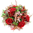 From a top-down perspective against a clean white background, this bouquet appears as a rich, domed cluster of red, pink, and green, the kind of romantic arrangement you might have delivered to a flat near Brent Cross shopping centre for an anniversary dinner. At its core, several deep crimson red roses open fully, their velvety petals spiralling inward in tight, luxurious layers that immediately suggest passion and devotion. Threaded between these statement blooms are delicate sprays of pale pink waxflower, each tiny star-shaped blossom tipped with a soft yellow centre, adding a lace-like delicacy that softens and brightens the crimson. Around the flowers, a thick layer of fresh green foliage provides structure and contrast, with leaves in vibrant emerald and darker forest shades overlapping in a natural, slightly textured way, like the greenery lining nearby Brent Park. Among the greens, distinctive accent leaves in burgundy, bronze, and chestnut brown appear, some with fine reddish-brown veins catching the light, bringing a sophisticated, subtly autumnal tone to the composition. Smaller dark red flowers-possibly alstroemeria, with their slimmer, bell-shaped blooms-nestle between the larger roses, creating extra pockets of colour and texture that pull the gaze around the bouquet. The entire arrangement is shaped into a generous, rounded dome, full and abundant, so that from this angle it reads as a continuous tapestry of petals and foliage. Just peeking out at the lower edge is a glimpse of a red and white patterned tag or ribbon, hinting at thoughtful wrapping and a personal note attached. The overall feeling is one of modern, elegant romance, perfect for Valentine's Day, anniversaries, or any heartfelt gesture shared across Brent Cross and the surrounding North London neighbourhoods.
